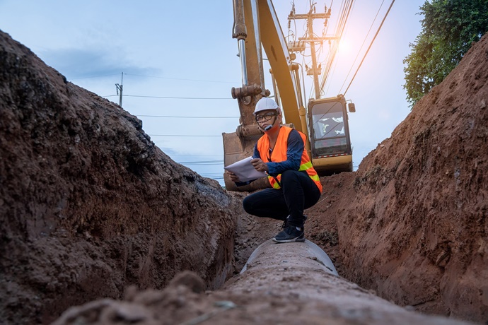 Contractor working in ditch