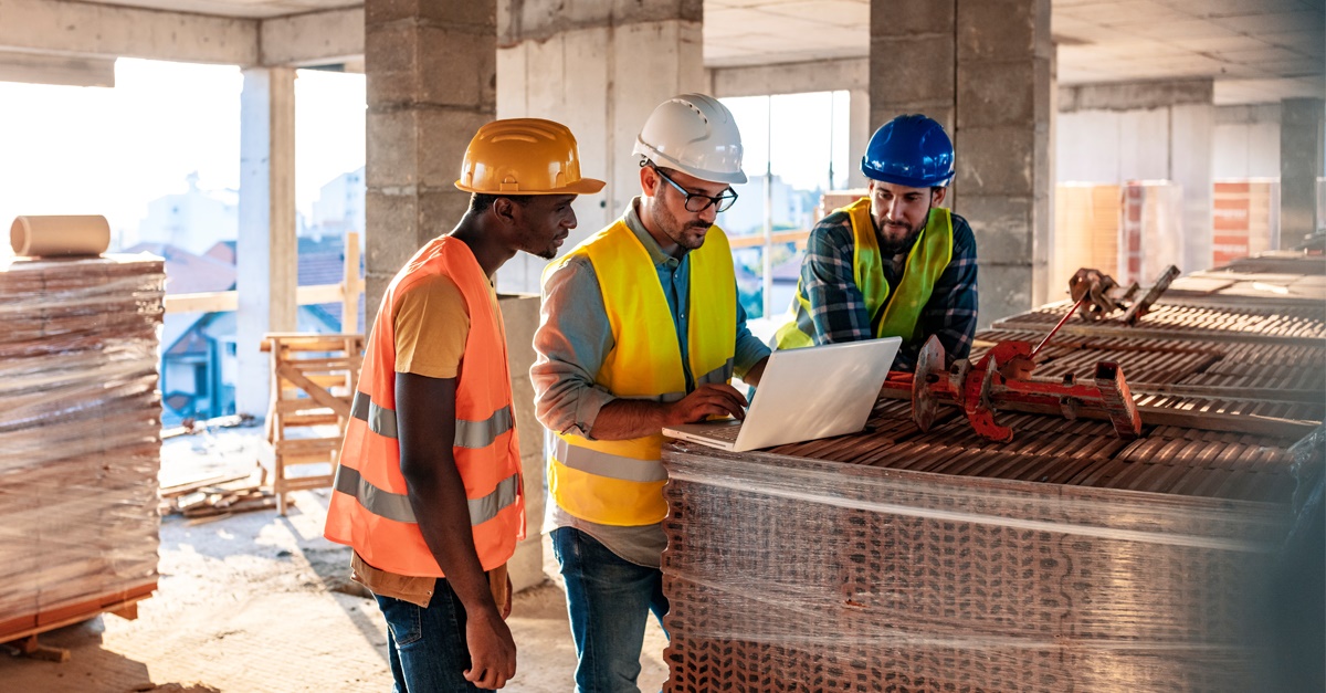 Construction crew meeting to discuss building plans