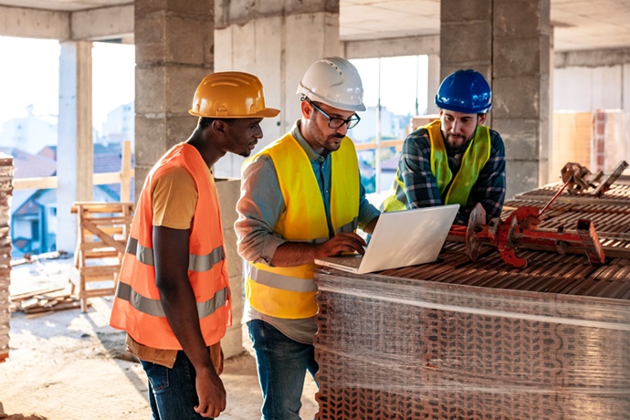 Construction crew meeting to discuss building plans