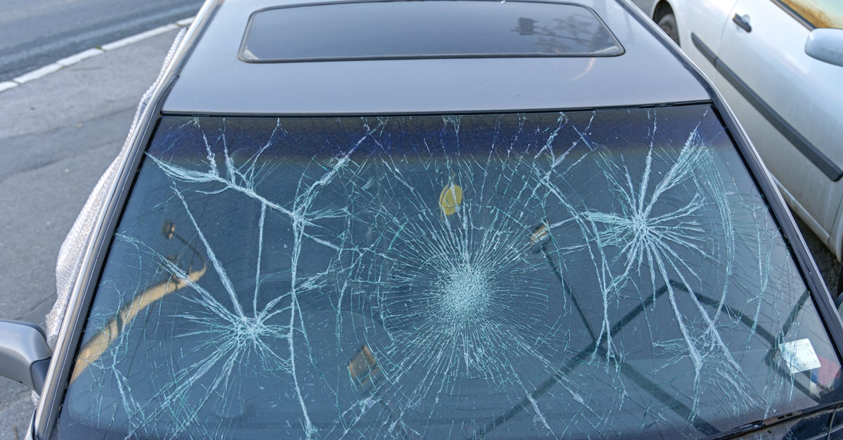Car windshield with hail damage