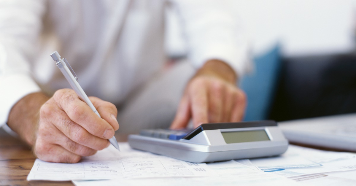 Accountant (CPA) works at calculator