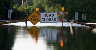 Flood high water road closed sign