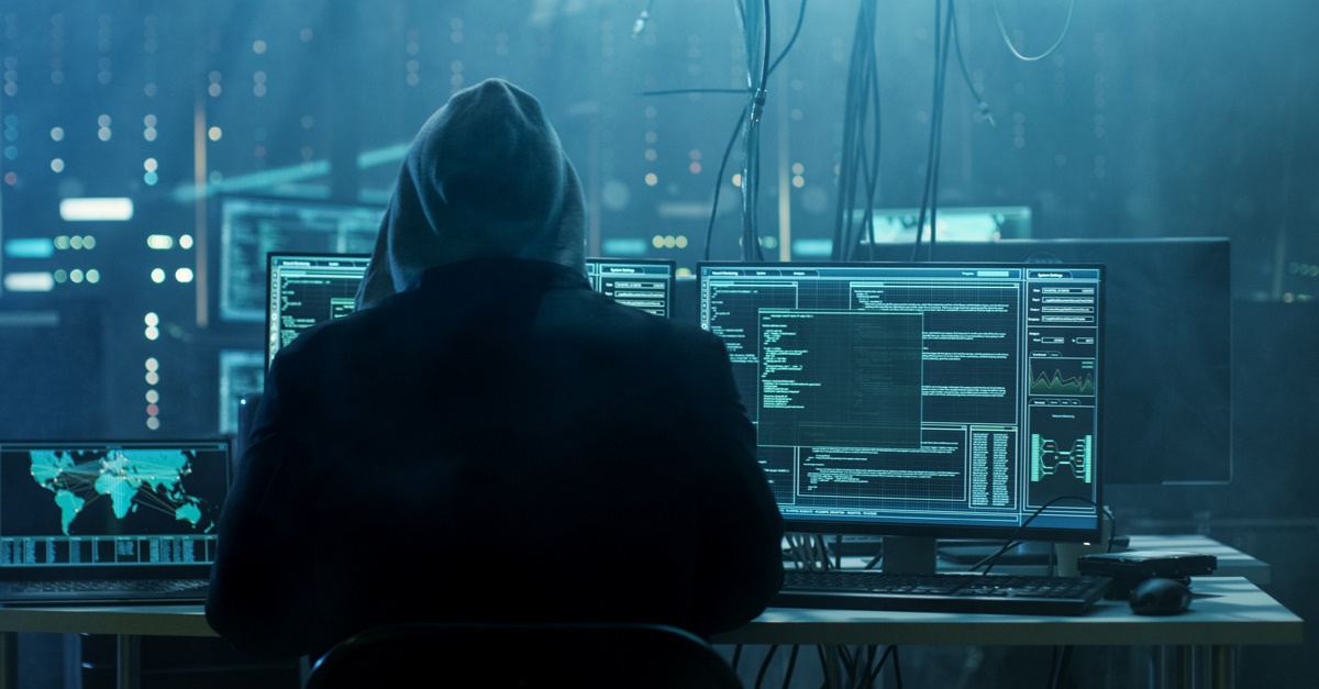 Hacker working to bypass cyber security safeguards