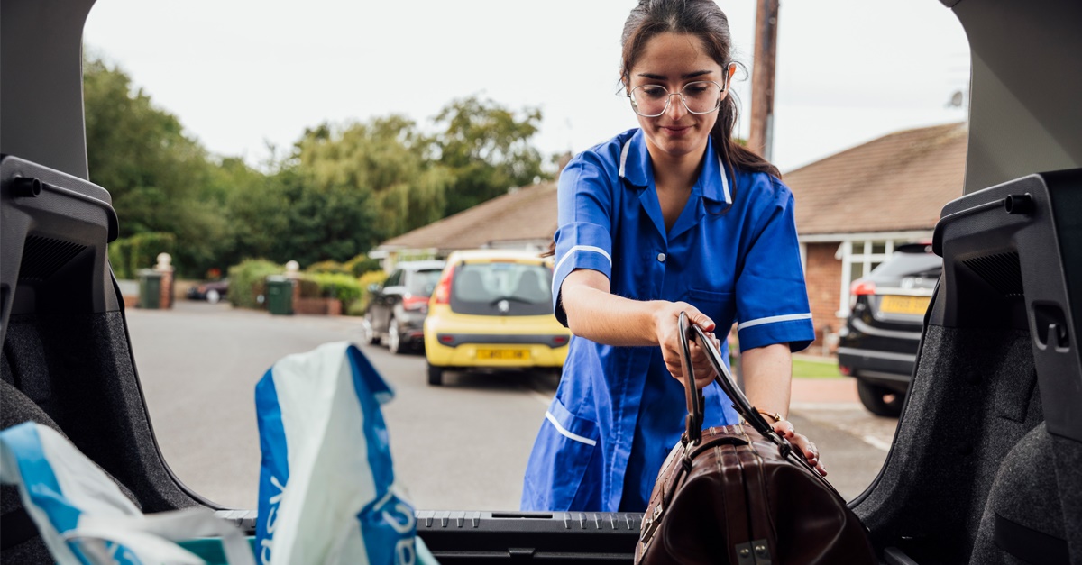 Home Health Care Worker Unloads Car