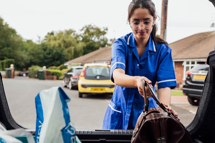 Home Health Care Worker Unloads Car