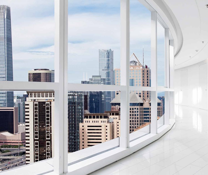 white-interior-hallway-overlooking-city