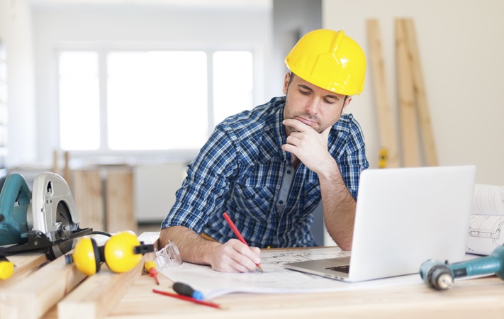 Architect with blueprint