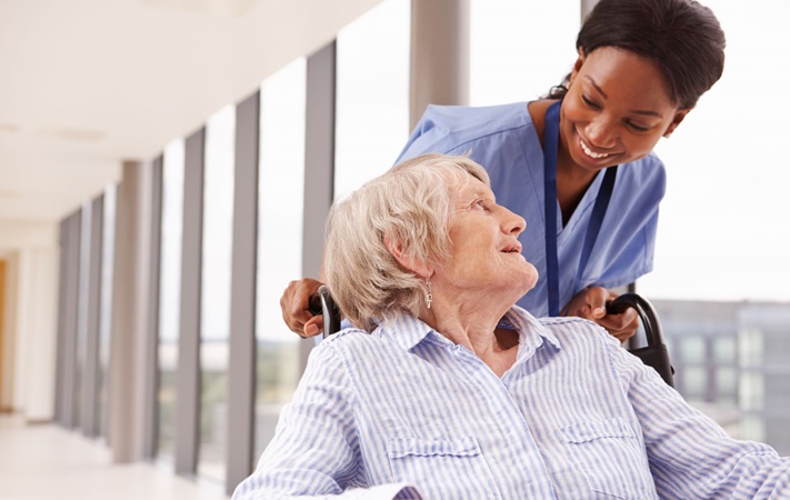 Nurse helping patient - healthcare workers comp